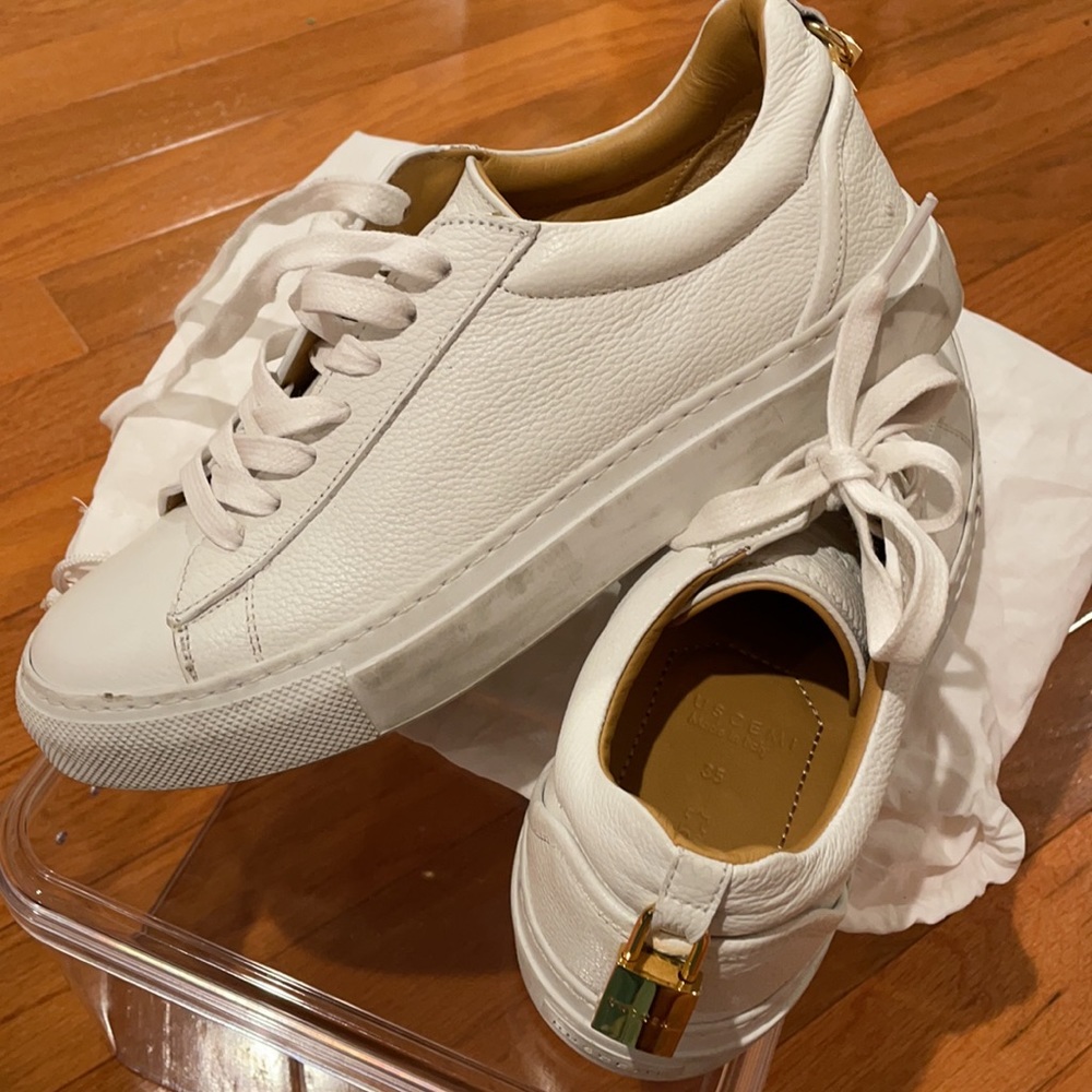 White Buscemi sneakers.